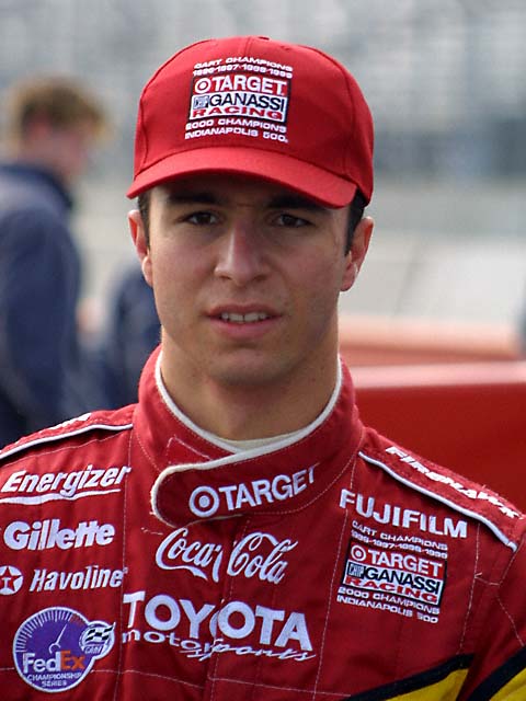 Bruno Junqueira, of Belo Horizonte, Brazil, guides his Ford-Cosworth Lola for Neman/Haas Racing through the nine turn of the course of the Grand Prix of Denver with other racers behind him on